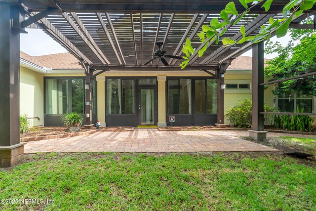 2305 Range Crescent Ct, Fleming Island, FL 32003 - back of property with a pergola, stucco siding, a patio, and ceiling fan