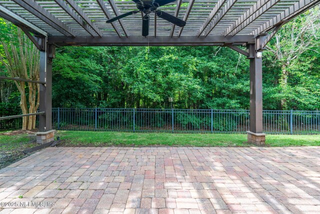 2305 Range Crescent Ct, Fleming Island, FL 32003 - fenced backyard featuring ceiling fan, a pergola, and a patio area