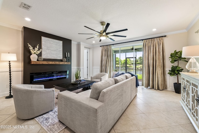 33 Crown Colony Rd, Saint Augustine, FL 32092 - living room featuring crown molding, a glass covered fireplace, ceiling fan, light tile patterned flooring, and recessed lighting