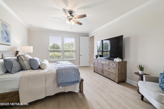 33 Crown Colony Rd, Saint Augustine, FL 32092 - bedroom with light wood finished floors, crown molding, ceiling fan, a textured ceiling, and baseboards