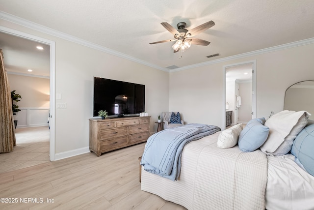 33 Crown Colony Rd, Saint Augustine, FL 32092 - bedroom with light wood-style flooring, crown molding, a ceiling fan, baseboards, and connected bathroom