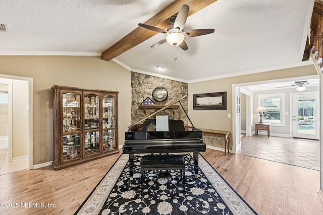 1816 Lakedge Dr, Middleburg, FL 32068 - sitting room featuring a ceiling fan, a textured ceiling, baseboards, ornamental molding, and light wood-style floors