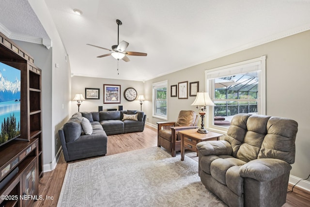 1816 Lakedge Dr, Middleburg, FL 32068 - living area with a ceiling fan, wood finished floors, baseboards, and crown molding
