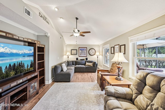 1816 Lakedge Dr, Middleburg, FL 32068 - living room with ceiling fan, lofted ceiling, wood finished floors, baseboards, and crown molding