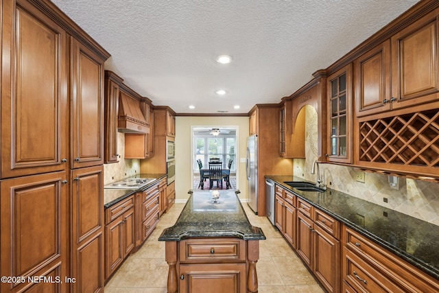 1816 Lakedge Dr, Middleburg, FL 32068 - kitchen with a sink, stainless steel appliances, glass insert cabinets, dark stone counters, and decorative backsplash