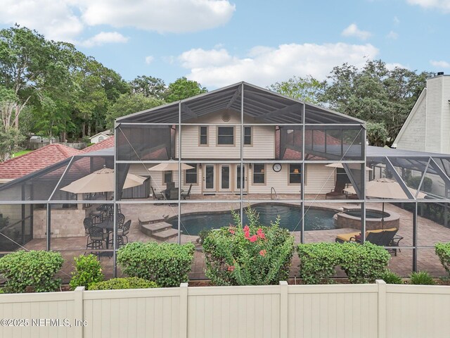 1816 Lakedge Dr, Middleburg, FL 32068 - back of property with a lanai, a patio, and a pool with connected hot tub