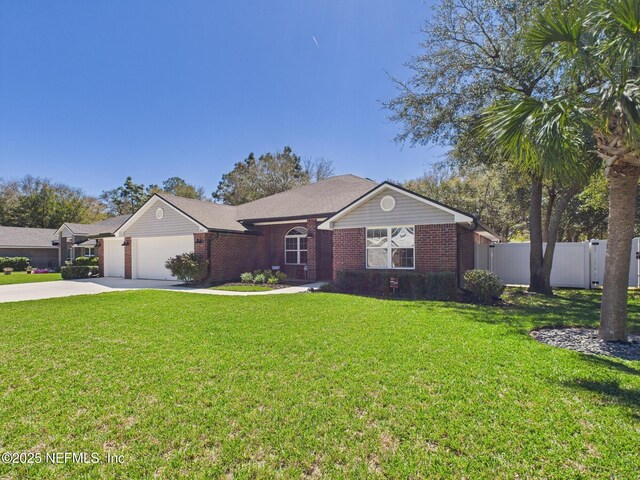 88137 Maybourne Rd, Yulee, FL 32097 - single story home with brick siding, concrete driveway, and an attached garage