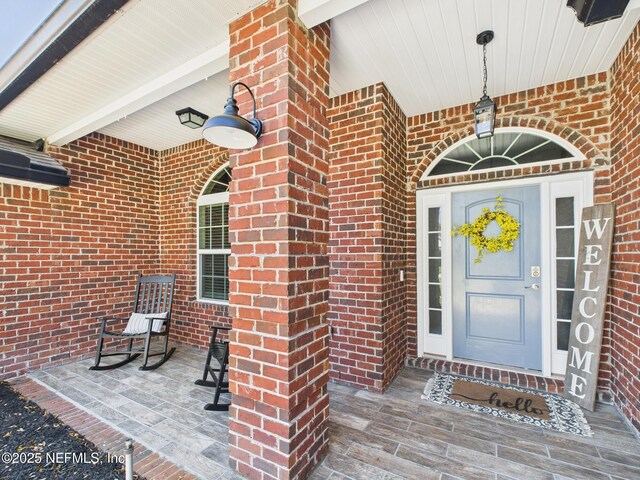 88137 Maybourne Rd, Yulee, FL 32097 - doorway to property featuring brick siding
