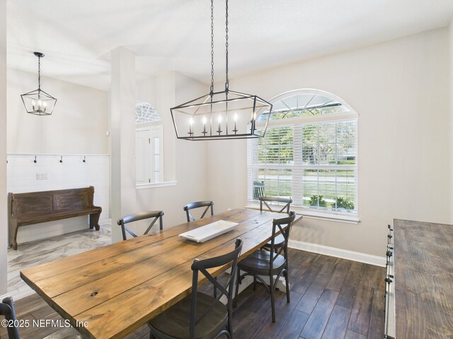 88137 Maybourne Rd, Yulee, FL 32097 - dining space featuring baseboards, a chandelier, and dark wood-style floors