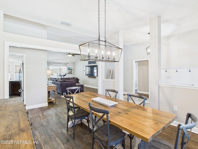 88137 Maybourne Rd, Yulee, FL 32097 - dining room with dark wood-style flooring, ceiling fan, and baseboards