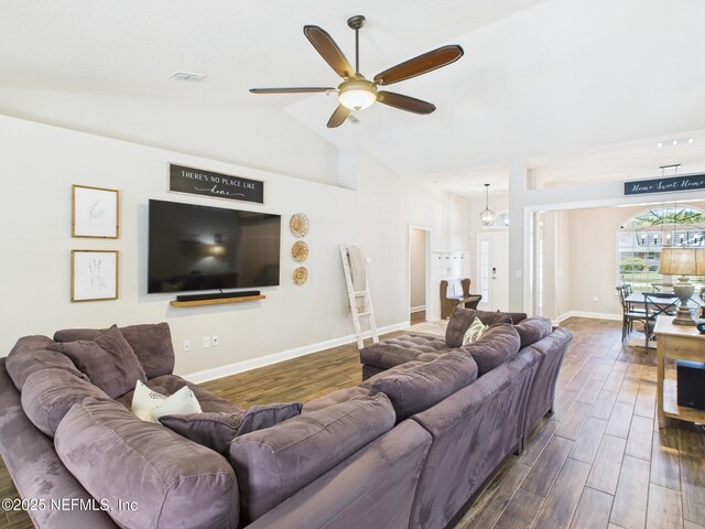 88137 Maybourne Rd, Yulee, FL 32097 - living room featuring dark wood-type flooring, ceiling fan, baseboards, and high vaulted ceiling