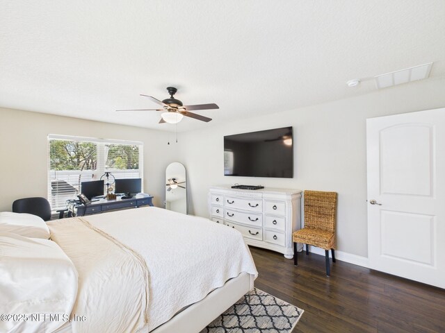 88137 Maybourne Rd, Yulee, FL 32097 - bedroom with dark wood-type flooring, baseboards, and a ceiling fan