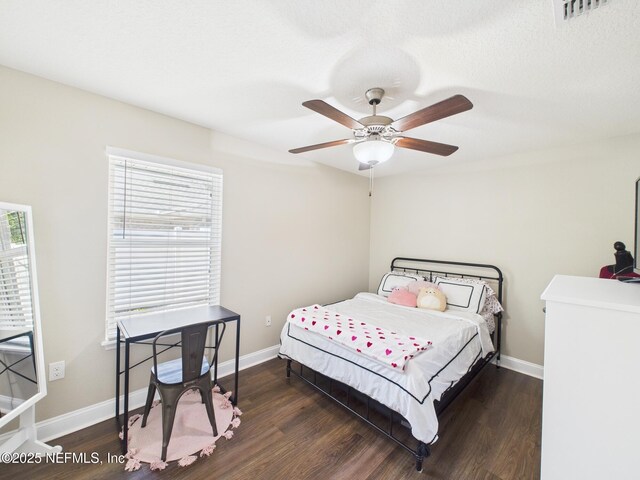 88137 Maybourne Rd, Yulee, FL 32097 - bedroom featuring wood finished floors, a ceiling fan, and baseboards