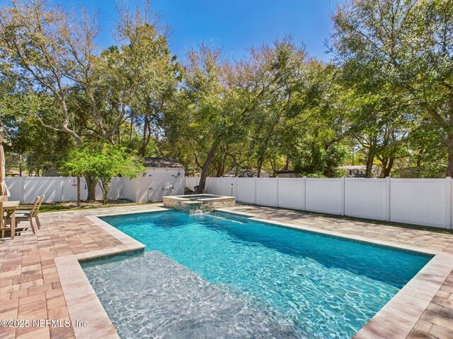 88137 Maybourne Rd, Yulee, FL 32097 - view of swimming pool featuring a patio area, a fenced backyard, and a pool with connected hot tub
