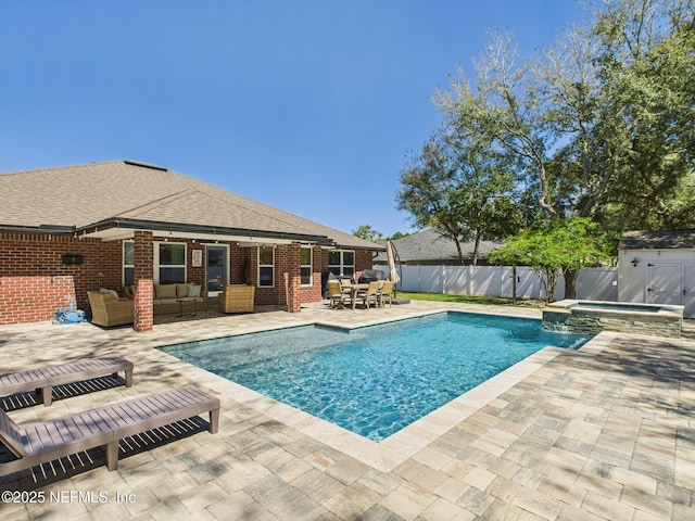 88137 Maybourne Rd, Yulee, FL 32097 - view of pool featuring outdoor lounge area, a fenced backyard, a patio area, a pool with connected hot tub, and an outdoor structure