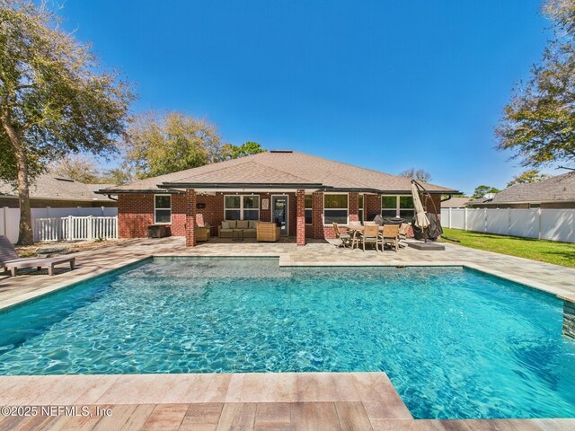 88137 Maybourne Rd, Yulee, FL 32097 - view of swimming pool with an outdoor living space, a fenced backyard, and a patio area