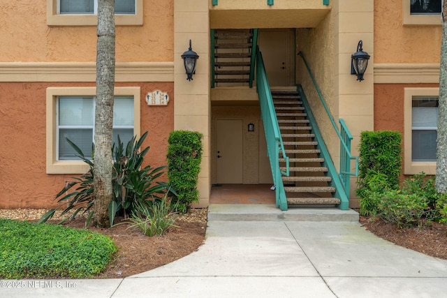 104 Laguna Villas Blvd Unit F33, Jacksonville Beach, FL 32250 - property entrance with stucco siding