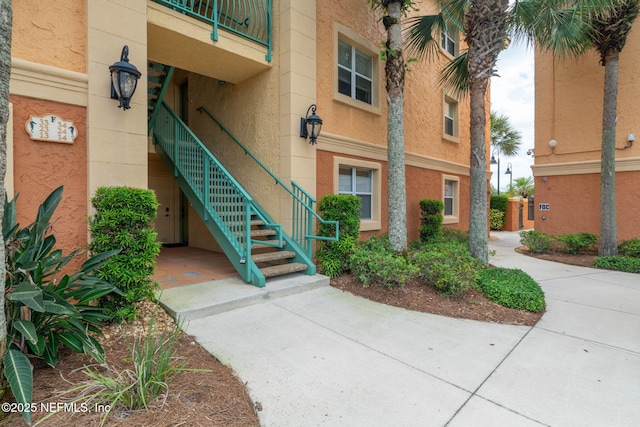 104 Laguna Villas Blvd Unit F33, Jacksonville Beach, FL 32250 - view of building exterior featuring stairway