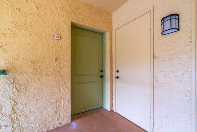 104 Laguna Villas Blvd Unit F33, Jacksonville Beach, FL 32250 - view of exterior entry with stucco siding