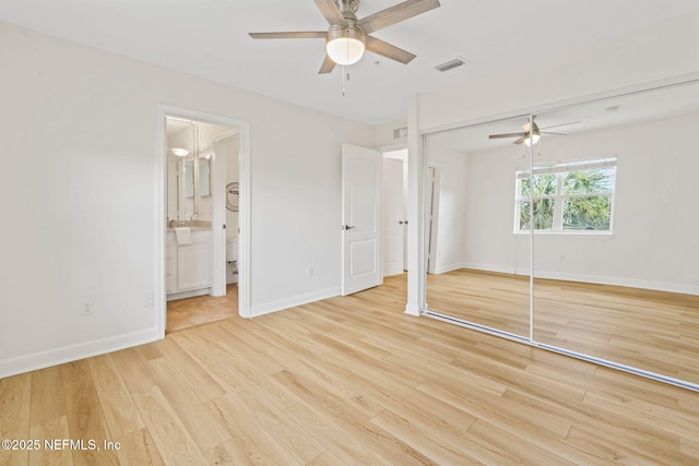 104 Laguna Villas Blvd Unit F33, Jacksonville Beach, FL 32250 - unfurnished bedroom featuring light wood-style floors, baseboards, a closet, and a ceiling fan
