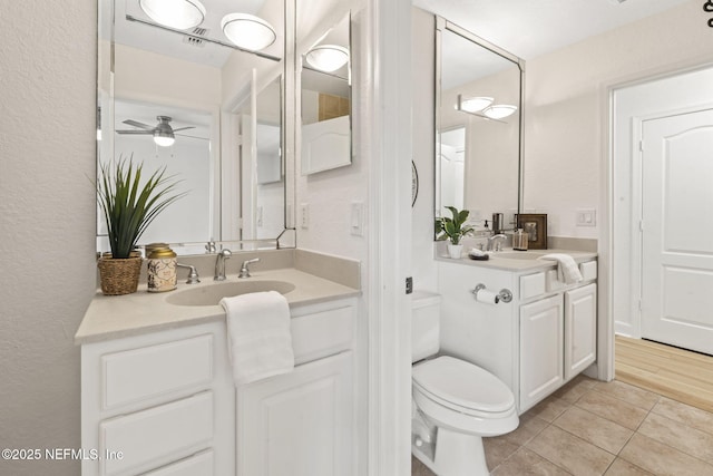 104 Laguna Villas Blvd Unit F33, Jacksonville Beach, FL 32250 - bathroom featuring vanity, tile patterned flooring, toilet, a textured wall, and ceiling fan