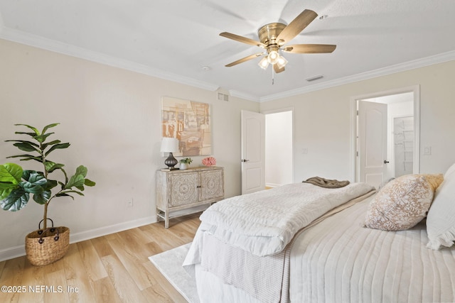 104 Laguna Villas Blvd Unit F33, Jacksonville Beach, FL 32250 - bedroom featuring ornamental molding, light wood-style flooring, and baseboards