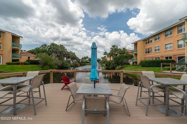 104 Laguna Villas Blvd Unit F33, Jacksonville Beach, FL 32250 - wooden terrace featuring outdoor dining area