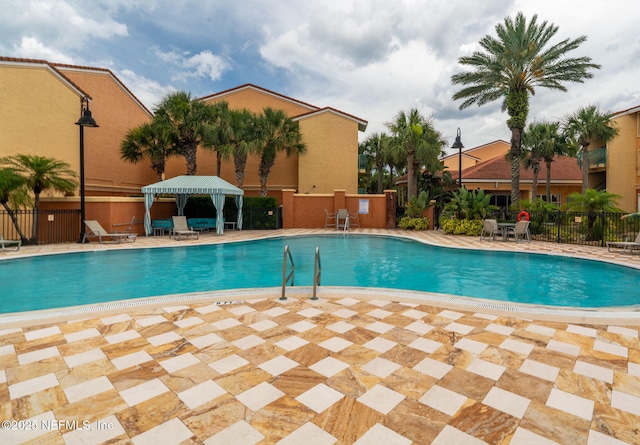104 Laguna Villas Blvd Unit F33, Jacksonville Beach, FL 32250 - community pool featuring a patio area