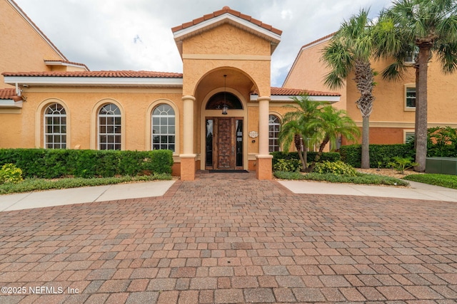 104 Laguna Villas Blvd Unit F33, Jacksonville Beach, FL 32250 - view of front of house featuring stucco siding and a tiled roof