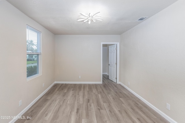 736 W St, Jacksonville, FL 32204 - spare room with light wood finished floors and baseboards