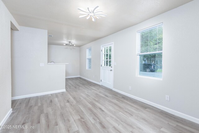 736 W St, Jacksonville, FL 32204 - empty room featuring light wood-style flooring and baseboards