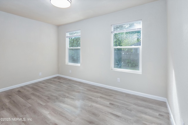 736 W St, Jacksonville, FL 32204 - empty room featuring light wood finished floors and baseboards