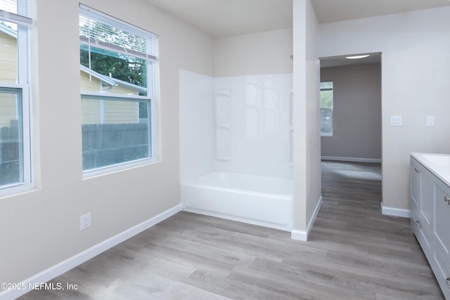736 W St, Jacksonville, FL 32204 - bathroom with vanity, wood finished floors, baseboards, and plenty of natural light