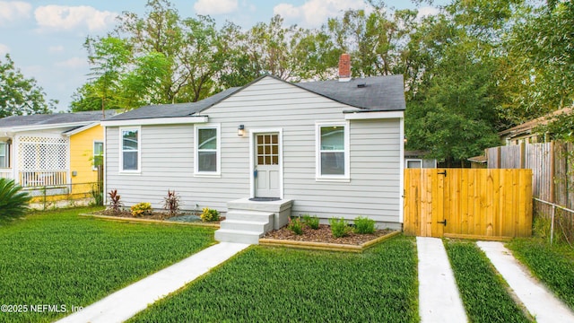 736 W St, Jacksonville, FL 32204 - bungalow-style house featuring a chimney and a shingled roof