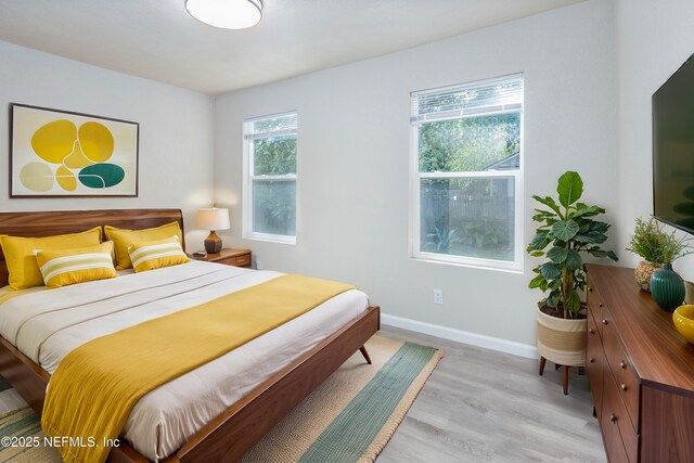 736 W St, Jacksonville, FL 32204 - bedroom with light wood finished floors and baseboards