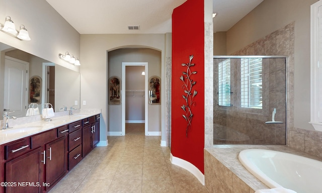 3653 Oglebay Dr, Green Cove Springs, FL 32043 - full bathroom with a garden tub, double vanity, tiled shower, tile patterned floors, and baseboards