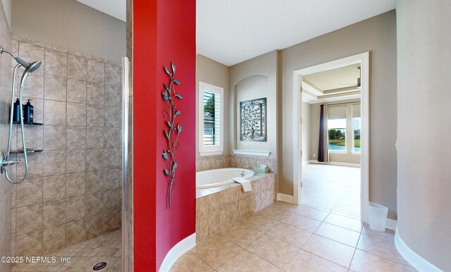 3653 Oglebay Dr, Green Cove Springs, FL 32043 - full bath featuring healthy amount of natural light, a tile shower, tile patterned flooring, and a garden tub