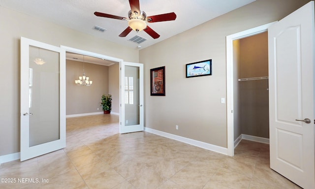 3653 Oglebay Dr, Green Cove Springs, FL 32043 - unfurnished room featuring french doors, a chandelier, ceiling fan, baseboards, and light tile patterned floors