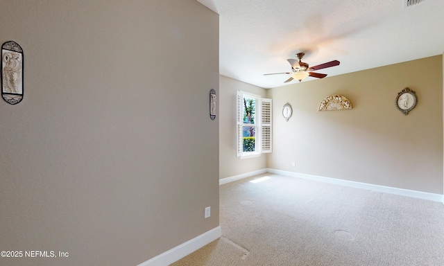 3653 Oglebay Dr, Green Cove Springs, FL 32043 - spare room featuring a ceiling fan, light carpet, and baseboards