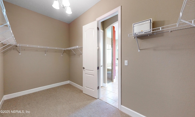 3653 Oglebay Dr, Green Cove Springs, FL 32043 - walk in closet with light colored carpet and a chandelier