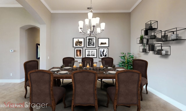 3653 Oglebay Dr, Green Cove Springs, FL 32043 - dining area featuring arched walkways, a chandelier, crown molding, baseboards, and light tile patterned floors