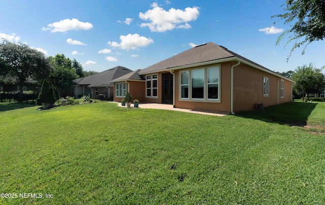 3653 Oglebay Dr, Green Cove Springs, FL 32043 - rear view of house with a lawn and a patio