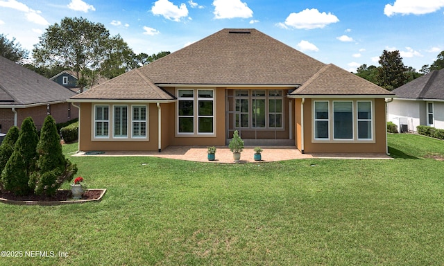 3653 Oglebay Dr, Green Cove Springs, FL 32043 - back of property with a yard, a patio area, stucco siding, and roof with shingles