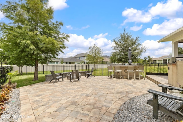 212 Foxcross Ave, Saint Johns, FL 32092 - view of patio with an outdoor fire pit and a residential view
