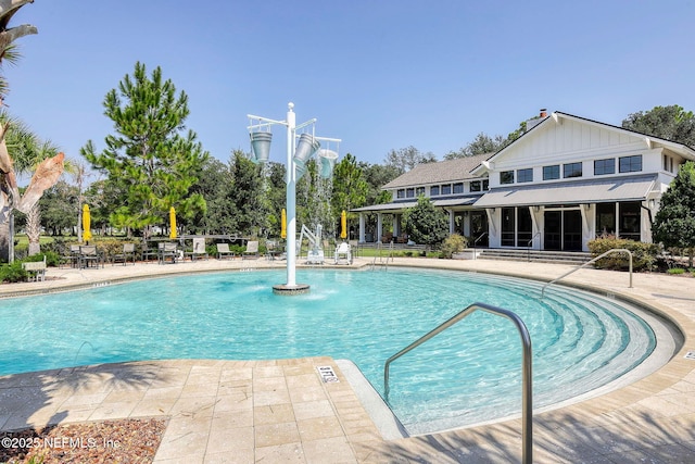 212 Foxcross Ave, Saint Johns, FL 32092 - community pool featuring a patio area