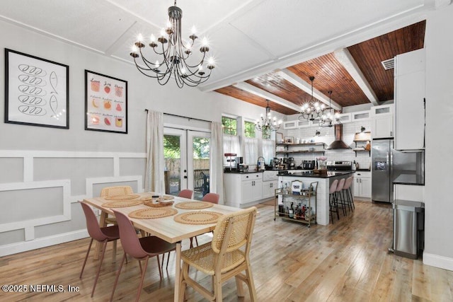 3040 Rosselle St, Jacksonville, FL 32205 - dining space with a chandelier, french doors, light wood-style flooring, and wooden ceiling with exposed beams
