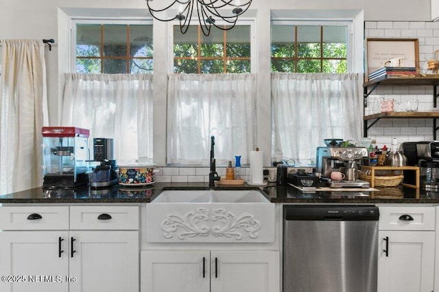 3040 Rosselle St, Jacksonville, FL 32205 - kitchen featuring dishwasher, a chandelier, dark stone countertops, white cabinets, and a sink