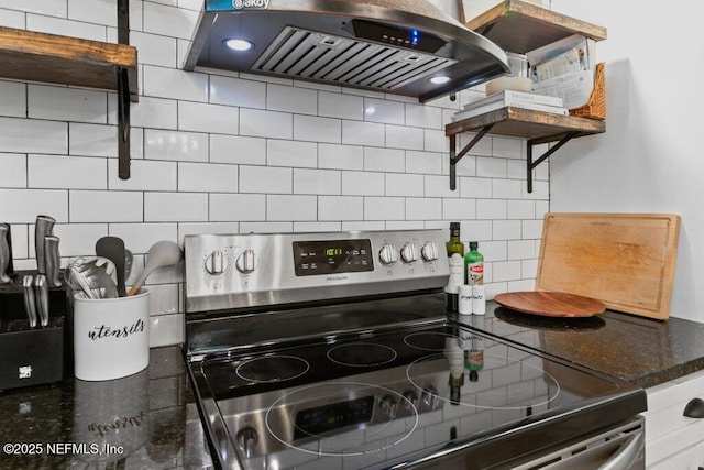 3040 Rosselle St, Jacksonville, FL 32205 - kitchen with electric range, island exhaust hood, decorative backsplash, and dark stone countertops