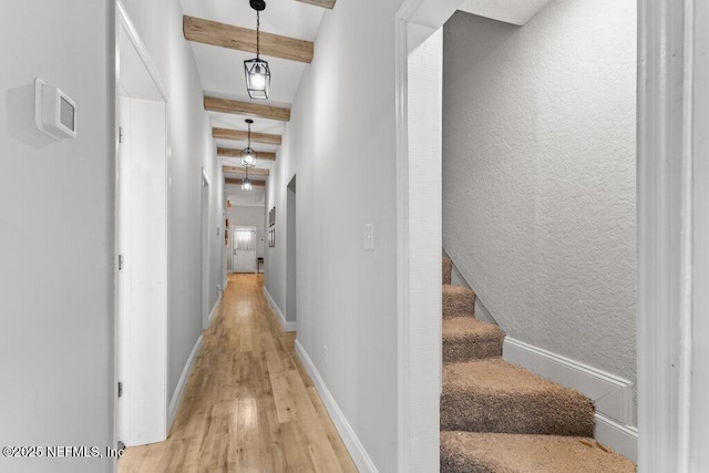 3040 Rosselle St, Jacksonville, FL 32205 - hallway with light wood-type flooring, beamed ceiling, baseboards, and stairway