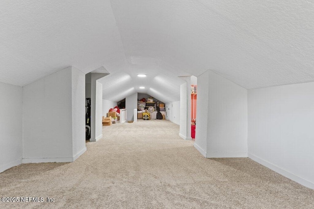 3040 Rosselle St, Jacksonville, FL 32205 - bonus room featuring carpet, lofted ceiling, a textured ceiling, and baseboards